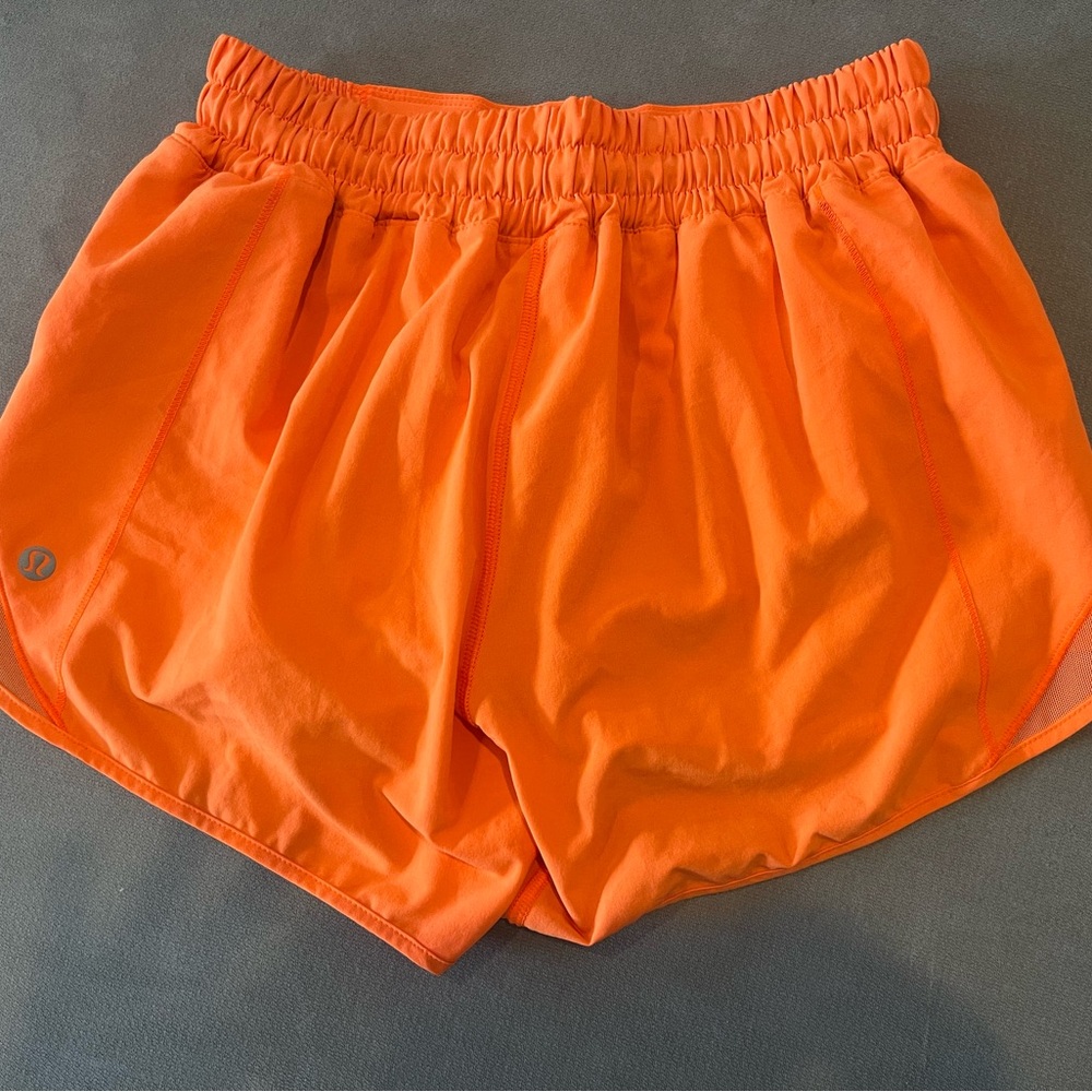 Lululemon athletica women's bright orange hotty hot shorts 4 inch, size 2